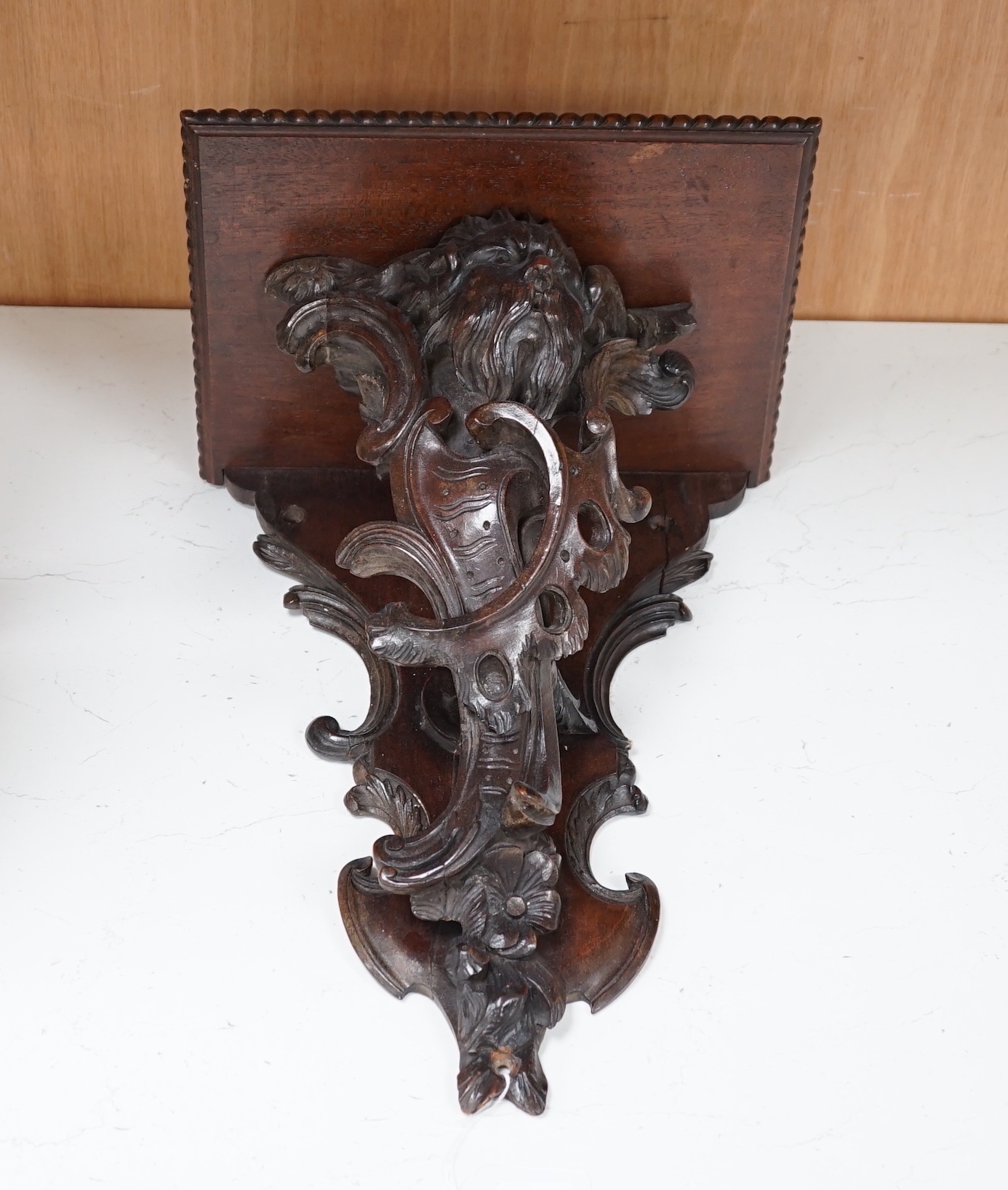 A 19th century carved walnut wall bracket, 41cm